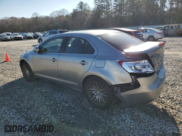 2011 Suzuki Kizashi SE z VIN JS2RE9A30B6110204, wystawiony jako Copart lot #85853384 z przebiegiem 168 962 mil mil oraz Szkoda całkowita • Salvage title. Historia ofert i sprzedaży dostępna na DreamBid. Obrazek 2.