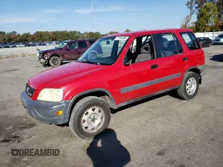 2000 Honda CR-V LX with VIN JHLRD1843YC063597, listed as a Copart auction lot 77765884 with 310,685 mi miles and Salvage Title. Bid and sale history available at carsss.com. Image 1.