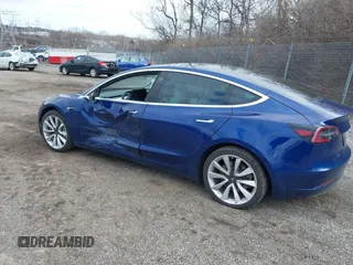 2020 Tesla Model 3 Long Range with VIN 5YJ3E1EB9LF601198, listed as a IAAI auction lot 41744287 with 70,322 mi miles and . Bid and sale history available at DreamBid. Image 3.