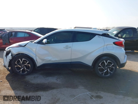 2021 Toyota C-HR LE with VIN JTNKHMBXXM1099019, listed as a IAAI auction lot 41525170 with 63,519 mi miles. Bid and sale history available at carsss.com. Image 14.