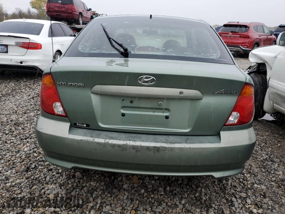 2003 Hyundai Accent GL with VIN KMHCG35C23U264701, listed as a Copart auction lot 80029154 with 142,090 mi miles and Salvage Title. Bid and sale history available at carsss.com. Image 6.