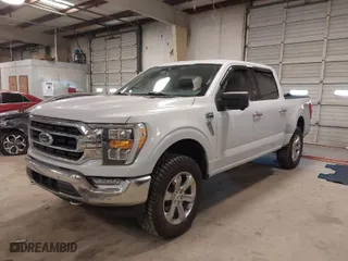 2021 Ford F-150 XL with VIN 1FTFW1E89MKD93309, listed as a IAAI auction lot 41413599 with 77,647 mi miles. Bid and sale history available at carsss.com. Image 2.