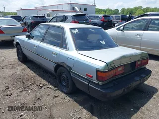 1988 Toyota Camry z VIN JT2SV21E1J3181554, wystawiony jako IAAI lot #42158520 z przebiegiem 167 012 mil mil oraz . Historia ofert i sprzedaży dostępna na DreamBid. Obrazek 3.