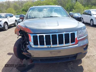 2011 Jeep Grand Cherokee Laredo with VIN 1J4RR4GGXBC587911, listed as a IAAI auction lot 42156885 with 178,999 mi miles and . Bid and sale history available at DreamBid. Image 12.