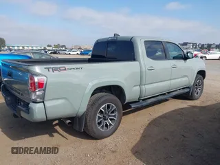 2022 Toyota Tacoma SR5 z VIN 3TMBZ5DN3NM034388, wystawiony jako IAAI lot #42270543 z przebiegiem 179 904 mil mil oraz . Historia ofert i sprzedaży dostępna na DreamBid. Obrazek 4.