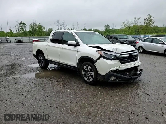 2017 Honda Ridgeline RTL-E with VIN 5FPYK3F72HB002890, listed as a Copart auction lot 57699735 with 128,813 mi miles and Salvage title. Bid and sale history available at DreamBid. Image 14.