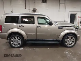 2007 Dodge Nitro SLT z VIN 1D8GU58K57W673543, wystawiony jako IAAI lot #41574634 z przebiegiem 64 286 mil mil oraz . Historia ofert i sprzedaży dostępna na DreamBid. Obrazek 14.