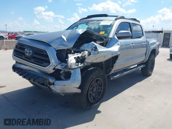 2018 Toyota Tacoma SR with VIN 3TMCZ5AN2JM172829, listed as a IAAI auction lot 42073847 with 136,671 mi miles and . Bid and sale history available at carsss.com. Image 2.
