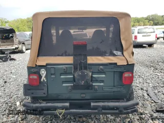2002 Jeep Wrangler Sahara with VIN 1J4FA59S52P763290, listed as a Copart auction lot 59115665 with 129,479 mi miles and Non repairable. Bid and sale history available at DreamBid. Image 6.