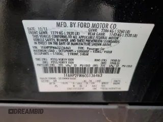 2012 Ford Taurus Limited z VIN 1FAHP2FW6CG136463, wystawiony jako Copart lot #57159005 z przebiegiem 124 833 mil mil oraz Szkoda całkowita • Salvage title. Historia ofert i sprzedaży dostępna na DreamBid. Obrazek 12.