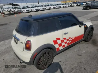 2007 MINI Hardtop with VIN WMWMF33547TT51590, listed as a Copart auction lot 57323995 with 114,113 mi miles and Salvage title. Bid and sale history available at DreamBid. Image 3.