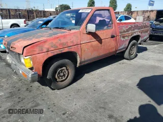 1987 Nissan Hardbody E z VIN JN6ND11S3HW006235, wystawiony jako Copart lot #78528914 z przebiegiem 298 079 mil mil oraz Szkody całkowita. Historia ofert i sprzedaży dostępna na DreamBid. Obrazek 1.