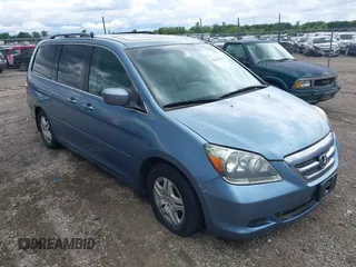2005 Honda Odyssey EX-L z VIN 5FNRL38755B126414, wystawiony jako IAAI lot #42327946 z przebiegiem 340 043 mil mil oraz . Historia ofert i sprzedaży dostępna na DreamBid. Obrazek 1.