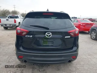 2016 Mazda CX-5 Grand Touring with VIN JM3KE2DY0G0651300, listed as a IAAI auction lot 41678833 with 98,790 mi miles. Bid and sale history available at carsss.com. Image 16.