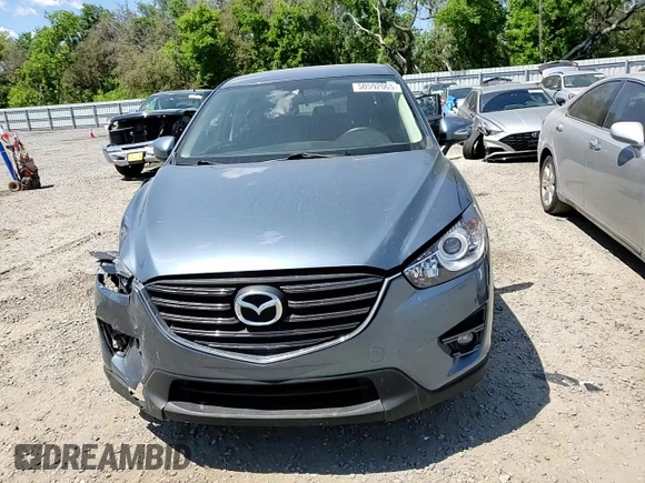 2016 Mazda CX-5 Touring with VIN JM3KE2CY0G0894283, listed as a Copart auction lot 50592065 with 86,400 mi miles and Salvage Title. Bid and sale history available at carsss.com. Image 12.