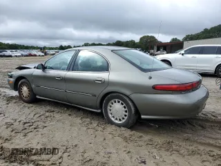 1999 Mercury Sable LS with VIN 1MEFM53U6XG646248, listed as a Copart auction lot 57859405 with 128,286 mi miles and Salvage title. Bid and sale history available at DreamBid. Image 2.
