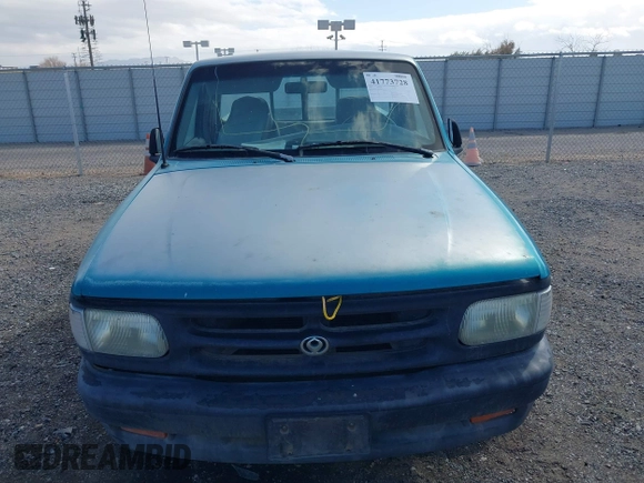 1995 Mazda B-Series Truck z VIN 4F4CR12A0STM09915, wystawiony jako IAAI lot #41773728 z przebiegiem 90 000 mil mil oraz . Historia ofert i sprzedaży dostępna na DreamBid. Obrazek 6.