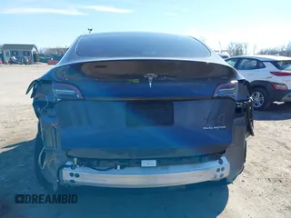 2023 Tesla Model Y Long Range with VIN 7SAYGDEE2PF883687, listed as a IAAI auction lot 41589837 with 36,890 mi miles. Bid and sale history available at carsss.com. Image 17.