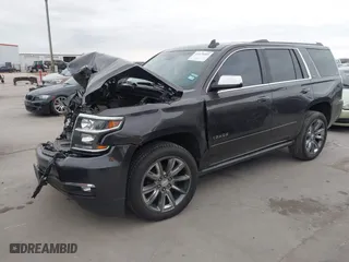 2015 Chevrolet Tahoe LTZ with VIN 1GNSCCKC7FR614886, listed as a IAAI auction lot 41679585 with 104,695 mi miles. Bid and sale history available at carsss.com. Image 17.