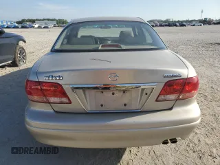 2001 Mazda Millenia z VIN JM1TA221911716600, wystawiony jako Copart lot #57639185 z przebiegiem 86 947 mil mil oraz Tytuł czysty. Historia ofert i sprzedaży dostępna na DreamBid. Obrazek 6.