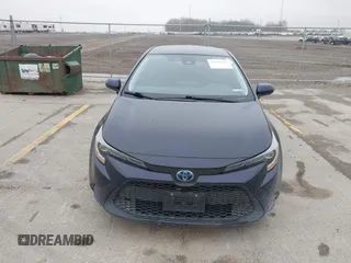 2021 Toyota Corolla Hybrid LE with VIN JTDEAMDE9MJ003172, listed as a IAAI auction lot 42062851 with 96,753 mi miles. Bid and sale history available at carsss.com. Image 13.