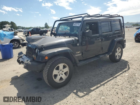 2012 Jeep Wrangler Unlimited Sahara with VIN 1C4HJWEG5CL205826, listed as a Copart auction lot 58222115 with 98,940 mi miles and Salvage title. Bid and sale history available at DreamBid. Image 1.