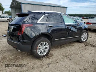 2023 Cadillac XT5 FWD Luxury z VIN 1GYKNAR40PZ106096, wystawiony jako Copart lot #80909074 z przebiegiem 19 677 mil mil oraz Nie do naprawy • Non repairable. Historia ofert i sprzedaży dostępna na DreamBid. Obrazek 3.