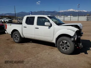 2018 Nissan Frontier Pro-4X with VIN 1N6AD0EV1JN715111, listed as a Copart auction lot 54012255 with 127,409 mi miles and Salvage title. Bid and sale history available at DreamBid. Image 4.