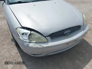 2005 Ford Taurus SE with VIN 1FAFP53U85A102770, listed as a IAAI auction lot 41963794 with 174,380 mi miles. Bid and sale history available at carsss.com. Image 6.