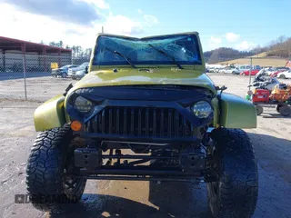 2007 Jeep Wrangler Unlimited Sahara with VIN 1J4GA59187L189519, listed as a IAAI auction lot 41204036 with 165,428 mi miles and . Bid and sale history available at DreamBid. Image 12.