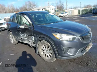 2015 Mazda CX-5 Sport with VIN JM3KE4BY1F0543507, listed as a IAAI auction lot 41530491 with 127,995 mi miles. Bid and sale history available at carsss.com. Image 1.