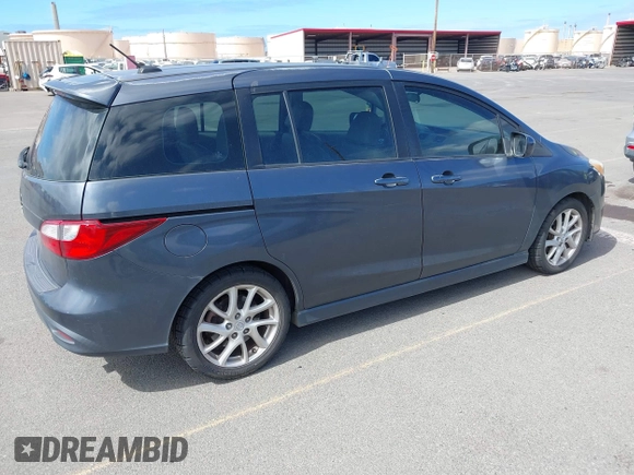 2012 Mazda 5 Grand Touring with VIN JM1CW2DL0C0139982, listed as a IAAI auction lot 42703430 with 129,763 mi miles and . Bid and sale history available at DreamBid. Image 4.