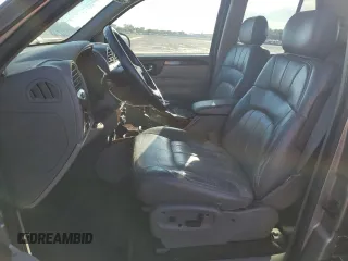 2002 GMC Envoy SLT with VIN 1GKDT13S122491329, listed as a Copart auction lot 75161714 with 149,659 mi miles and Salvage Title. Bid and sale history available at DreamBid. Image 7.