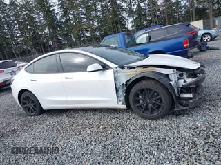 2023 Tesla Model 3 with VIN 5YJ3E1EA2PF612427, listed as a IAAI auction lot 41793756 with 17,913 mi miles and . Bid and sale history available at carsss.com. Image 14.