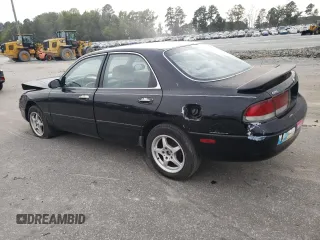 1996 Mazda 626 z VIN 1YVGE22C2T5585359, wystawiony jako Copart lot #74568444 z przebiegiem 159 922 mil mil oraz Szkody całkowita. Historia ofert i sprzedaży dostępna na DreamBid. Obrazek 2.