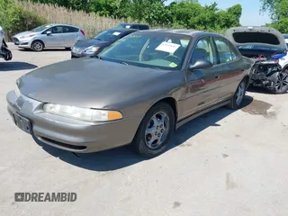 1999 Oldsmobile Intrigue GX z VIN 1G3WH52K5XF334949, wystawiony jako IAAI lot #42252647 z przebiegiem 80 705 mil mil oraz . Historia ofert i sprzedaży dostępna na DreamBid. Obrazek 2.