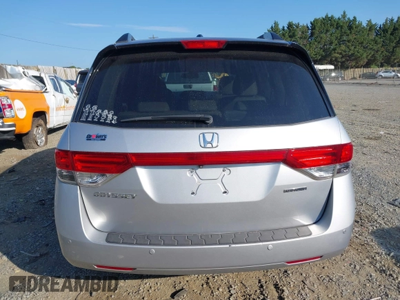 2014 Honda Odyssey Touring with VIN 5FNRL5H95EB108427, listed as a IAAI auction lot 39992643 with 100,658 mi miles and . Bid and sale history available at DreamBid. Image 16.
