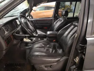 1998 Jeep Grand Cherokee Limited with VIN 1J4GZ88Z3WC165659, listed as a Copart auction lot 87527255 with 203,860 mi miles and Salvage Title. Bid and sale history available at carsss.com. Image 7.