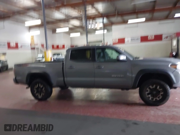 2021 Toyota Tacoma SR5 z VIN 3TMDZ5BN5MM114494, wystawiony jako IAAI lot #41723032 z przebiegiem 54 477 mil mil oraz . Historia ofert i sprzedaży dostępna na DreamBid. Obrazek 13.