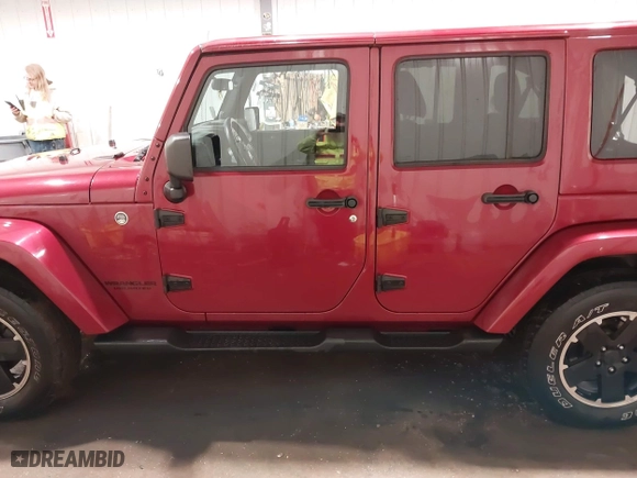 2012 Jeep Wrangler Unlimited Sahara with VIN 1C4BJWEG0CL256852, listed as a IAAI auction lot 41765640 with 171,408 mi miles. Bid and sale history available at carsss.com. Image 15.