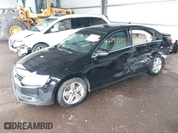 2012 Volkswagen Jetta TDI w/Premium & Nav with VIN 3VWLL7AJ8CM326549, listed as a IAAI auction lot 42748170 with 200,385 mi miles and . Bid and sale history available at DreamBid. Image 2.