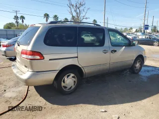 2002 Toyota Sienna LE with VIN 4T3ZF13C72U506585, listed as a Copart auction lot 77424794 with 253,337 mi miles and Clean Title. Bid and sale history available at carsss.com. Image 3.