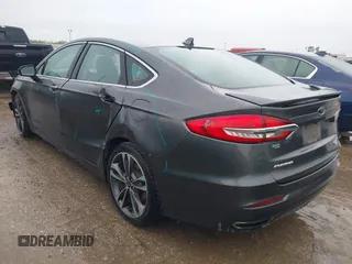 2020 Ford Fusion Titanium with VIN 3FA6P0K97LR192657, listed as a IAAI auction lot 42170258 with 87,696 mi miles and . Bid and sale history available at DreamBid. Image 3.
