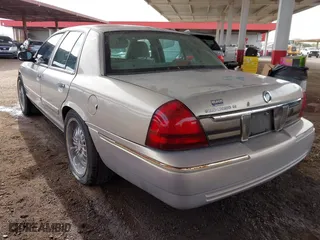 2006 Mercury Grand Marquis GS with VIN 2MEFM74VX6X638763, listed as a IAAI auction lot 41735612 with 123,914 mi miles. Bid and sale history available at carsss.com. Image 3.