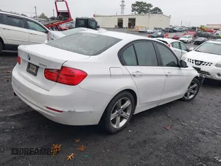 2015 BMW 3 Series 320i with VIN WBA3B1C51FP831380, listed as a IAAI auction lot 41044053 with 187,660 mi miles. Bid and sale history available at carsss.com. Image 4.