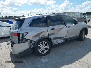 2016 Honda Pilot LX with VIN 5FNYF6H1XGB099987, listed as a IAAI auction lot 41556979 with 98,373 mi miles. Bid and sale history available at carsss.com. Image 4.
