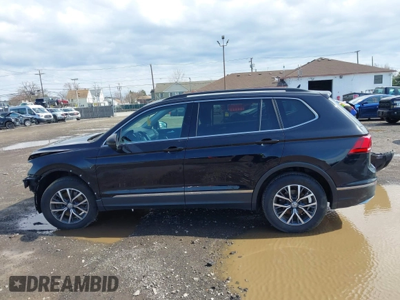 2020 Volkswagen Tiguan SE with VIN 3VV2B7AX5LM091857, listed as a IAAI auction lot 41922727 with 83,464 mi miles and . Bid and sale history available at DreamBid. Image 14.