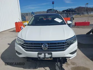 2021 Volkswagen Jetta S z VIN 3VWC57BU0MM070993, wystawiony jako IAAI lot #41650935 z przebiegiem 58 683 mil mil oraz . Historia ofert i sprzedaży dostępna na DreamBid. Obrazek 13.