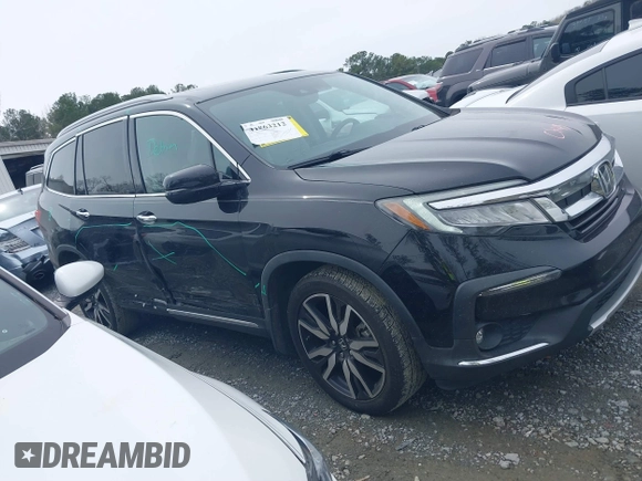 2019 Honda Pilot Touring 7-Passenger z VIN 5FNYF5H66KB027960, wystawiony jako IAAI lot #41863212 z przebiegiem 114 615 mil mil oraz . Historia ofert i sprzedaży dostępna na DreamBid. Obrazek 13.