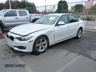 2015 BMW 3 Series 320i with VIN WBA3B1C5XFK137171, listed as a IAAI auction lot 41736278 with 28,673 mi miles. Bid and sale history available at carsss.com. Image 2.